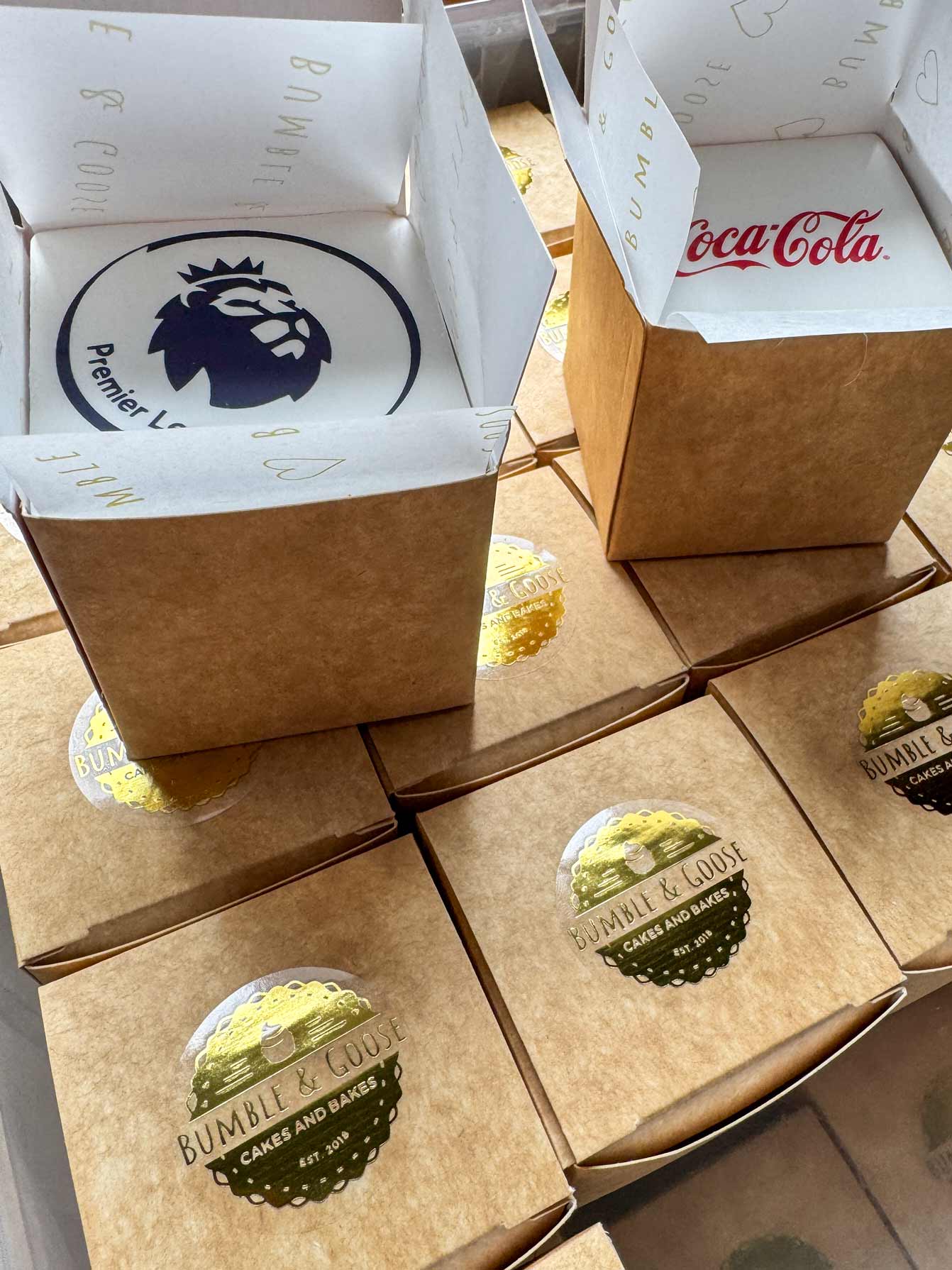 Premier League and Coca-Cola branded mini cakes in individual Bumble & Goose gift boxes custom corporate gifting
