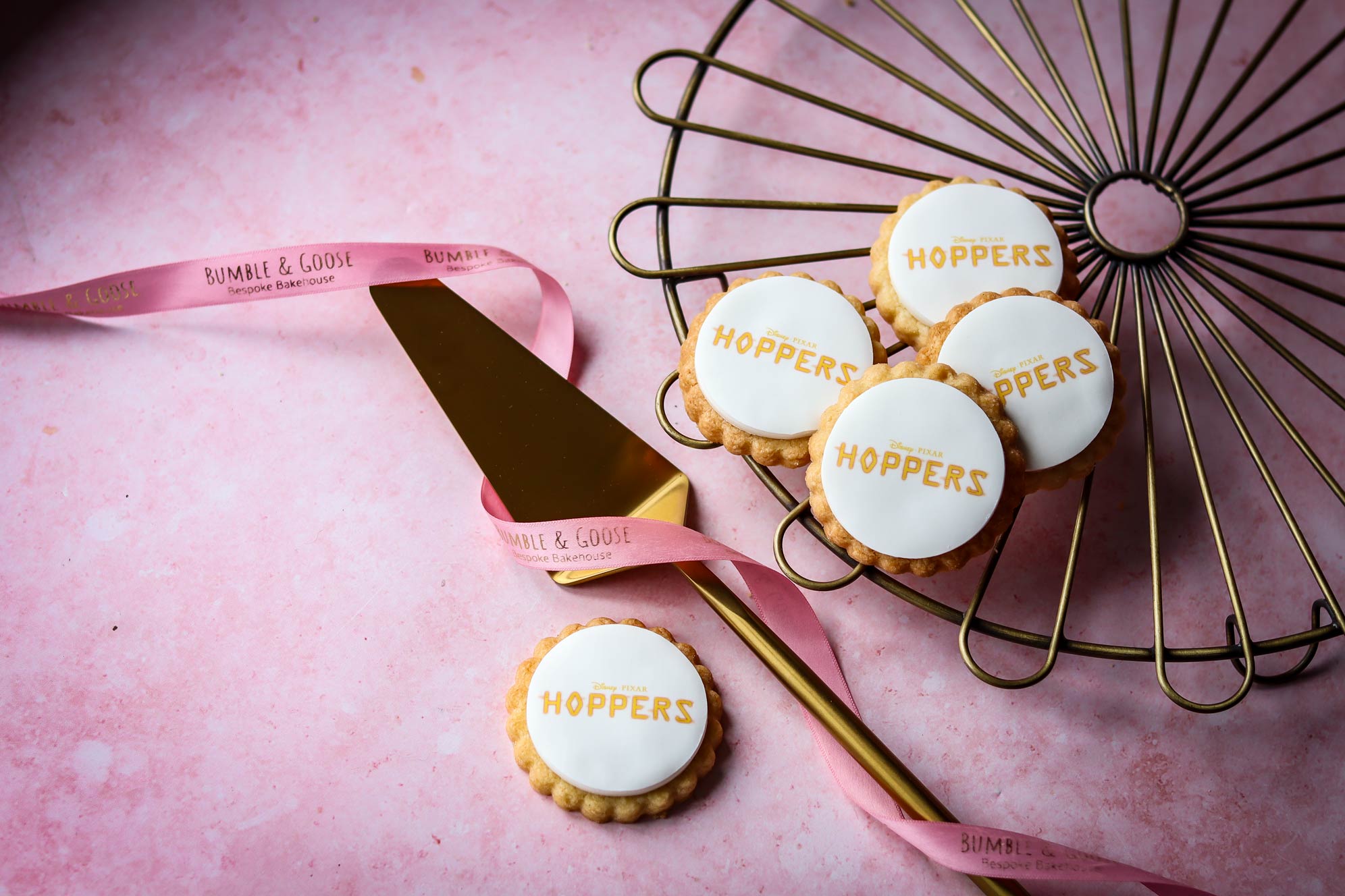 Disney Pixar Hoppers branded biscuits gold logo print custom personalised biscuits Disney Pixar event Bumble & Goose